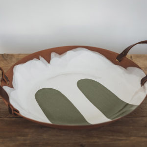 Large serving dish with a grey base colour. Two forest green brush strokes of glaze and two leather handles