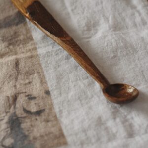 Close up detail of a hand carved wooden spoon