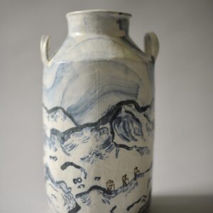 White and blue Ceramic milk churn vesel with hand-drawn depictions of a Welsh mountainscape.