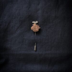 Copper ship pin made from a vintage coin.